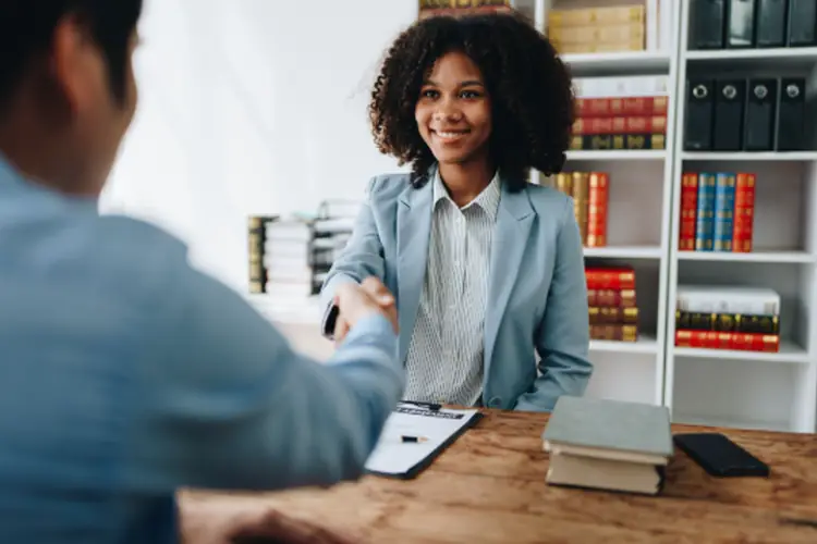 An attorney in a meeting with their client discussing the probate process.