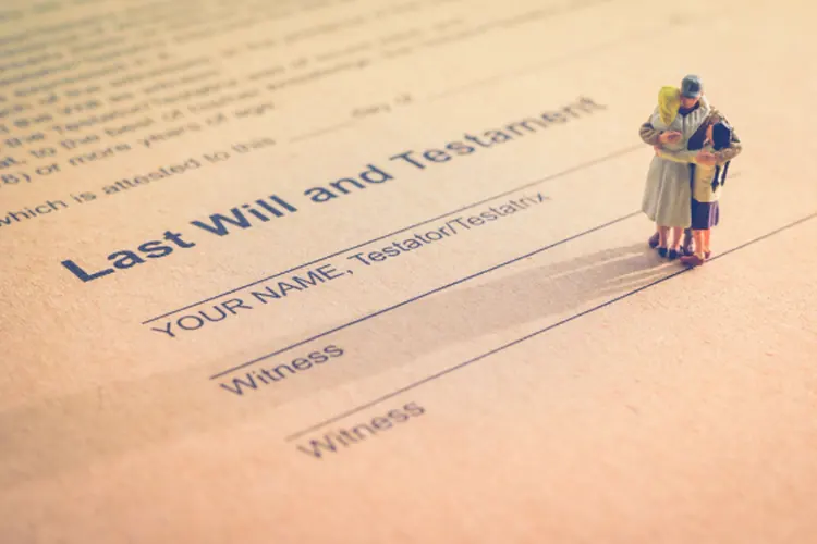 last-will-miniature-couple Last will and testament and inheritance concept.