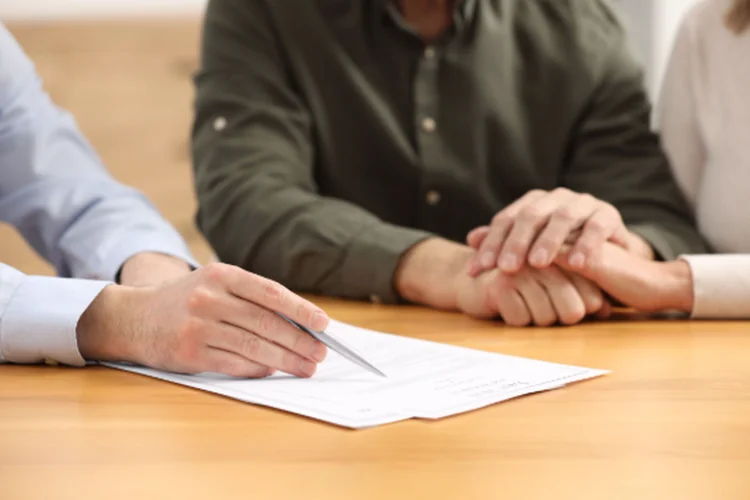 probate-paperwork-support-750x500-under-20kb two people talking to an attorney, asking how long can probate last